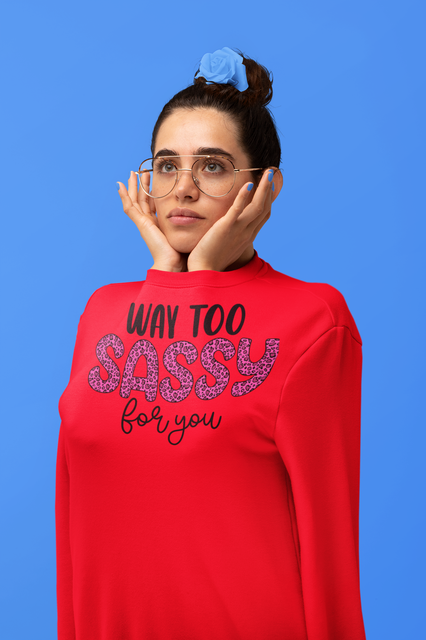 Person wearing a red sweatshirt with text on a blue background