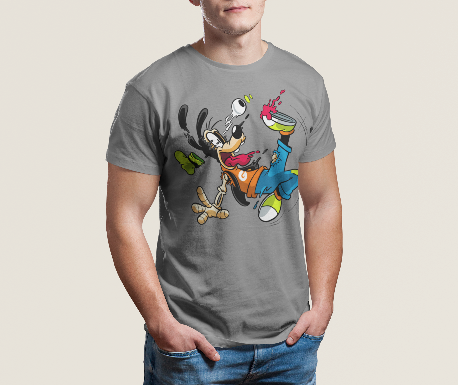 Person wearing a gray t-shirt with cartoon character design on a plain background