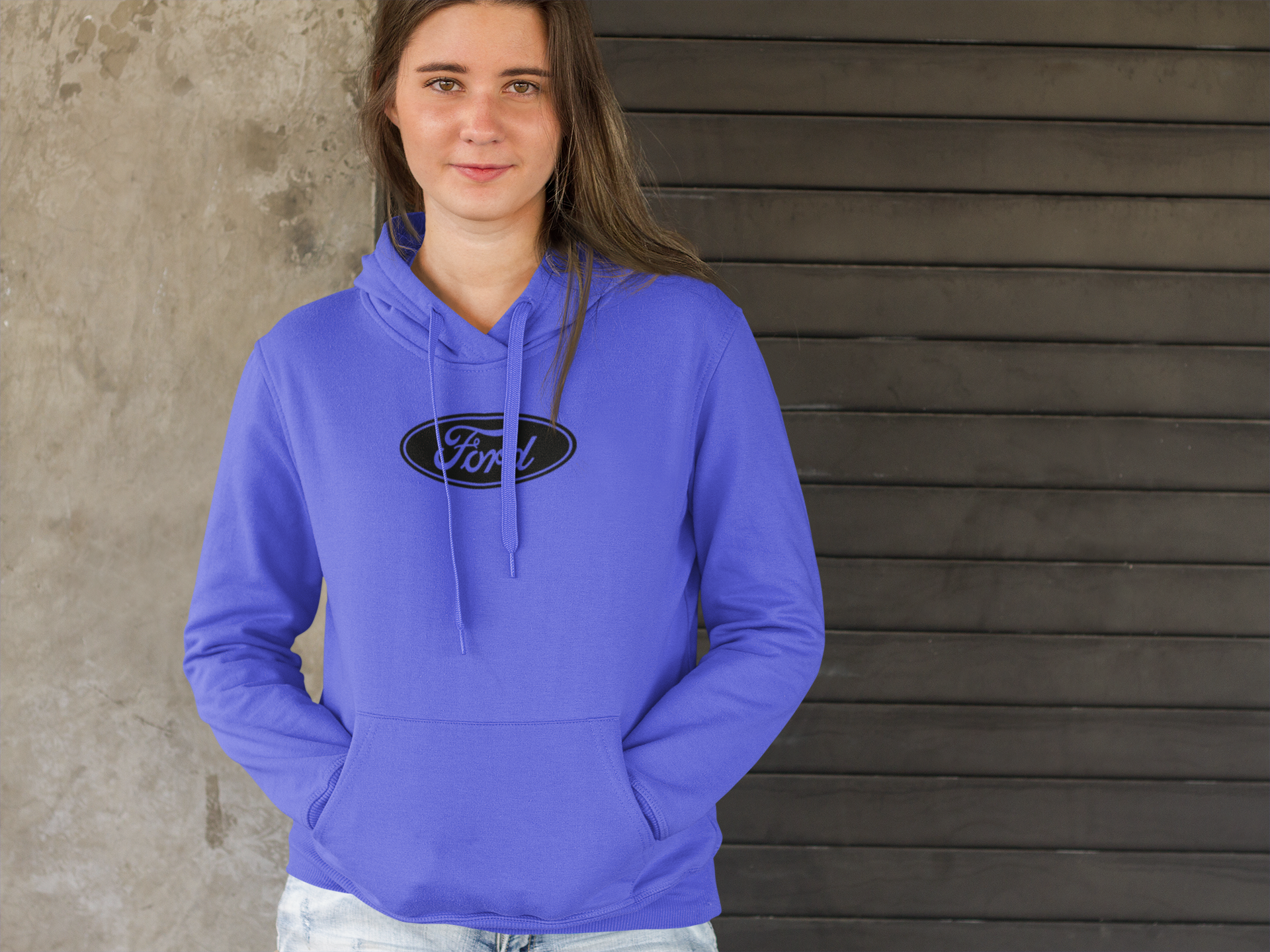 gildan 18500  purple hoodie with a Ford logo against a wooden wall.