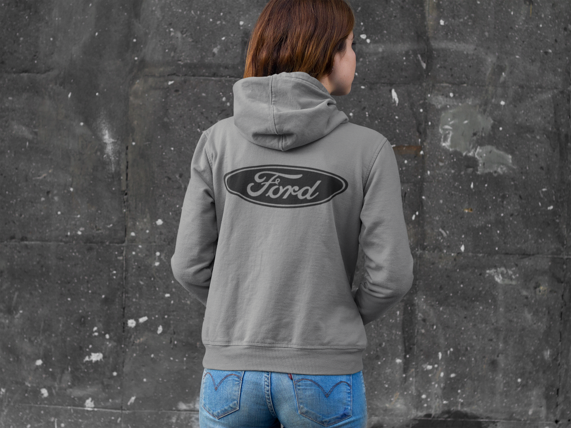 gray hoodie with a Ford logo against a textured wall. gildan 18500 hoodie 