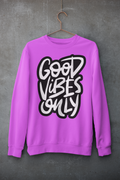 pink sweatshirt with 'Good Vibes Only' text on a gray background