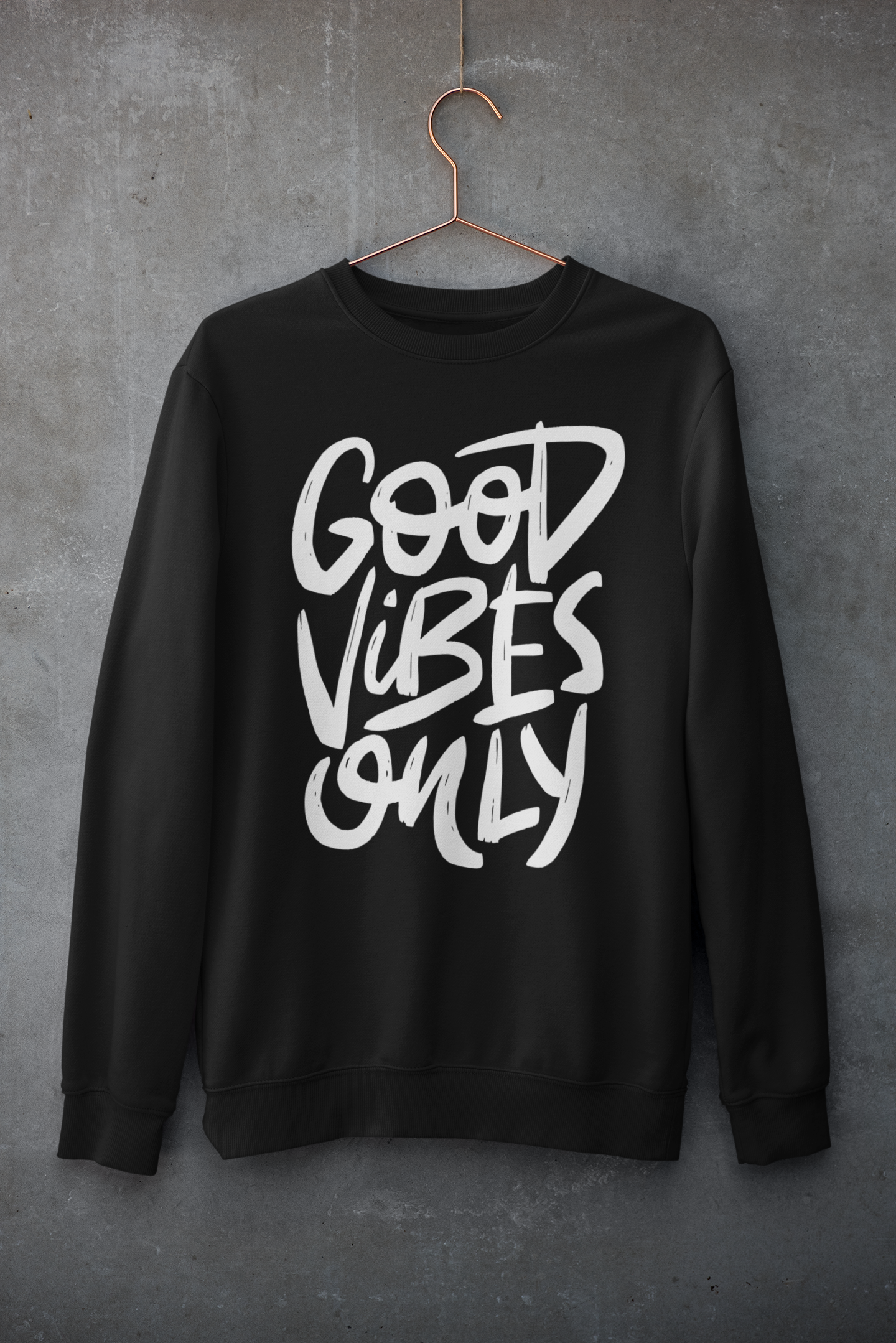 Black sweatshirt with 'Good Vibes Only' text on a gray background