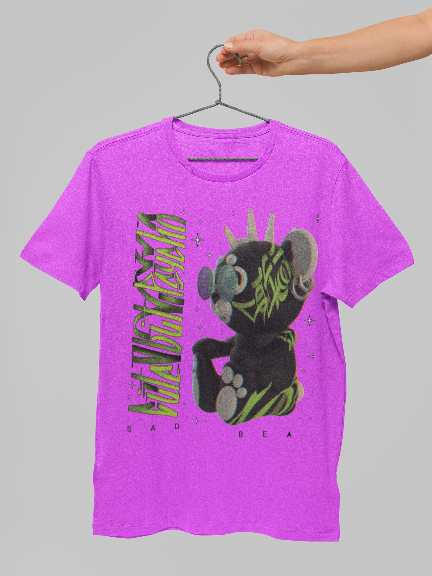 Pink t-shirt with graphic design on a gray background
