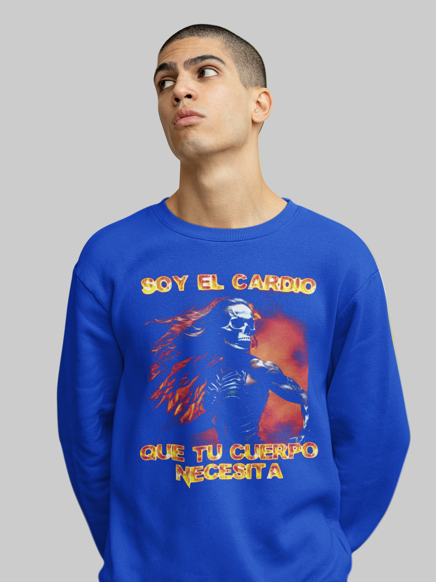 Person wearing a blue sweatshirt with graphic design and text against a striped background